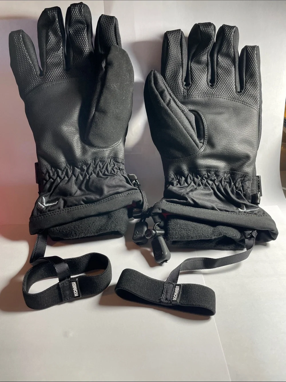 Women’s Black Kombi Cuff Gloves, size small, with wrist straps loss protection.
